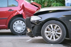 Red car rear-ended by back car