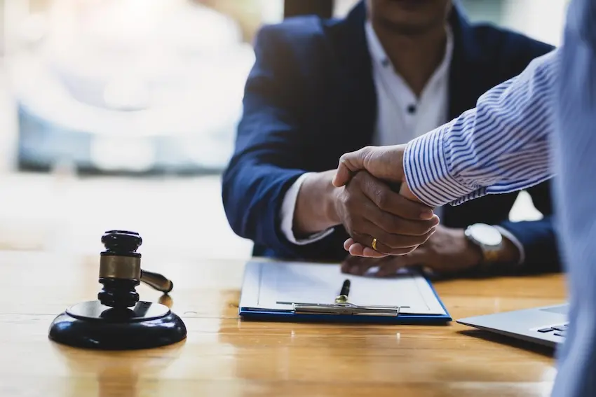 Atlanta car accident lawyer meeting with client during free consultation about contingency fees.