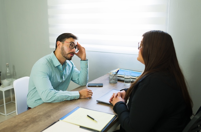 Delayed injury treatment consultation with an attorney discussing symptoms appearing after a car crash.