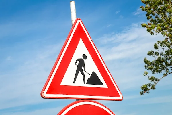 A roadwork warning sign represents an Atlanta construction zone car accident case.